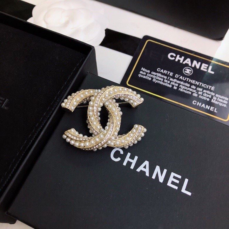 Ch**el brooches